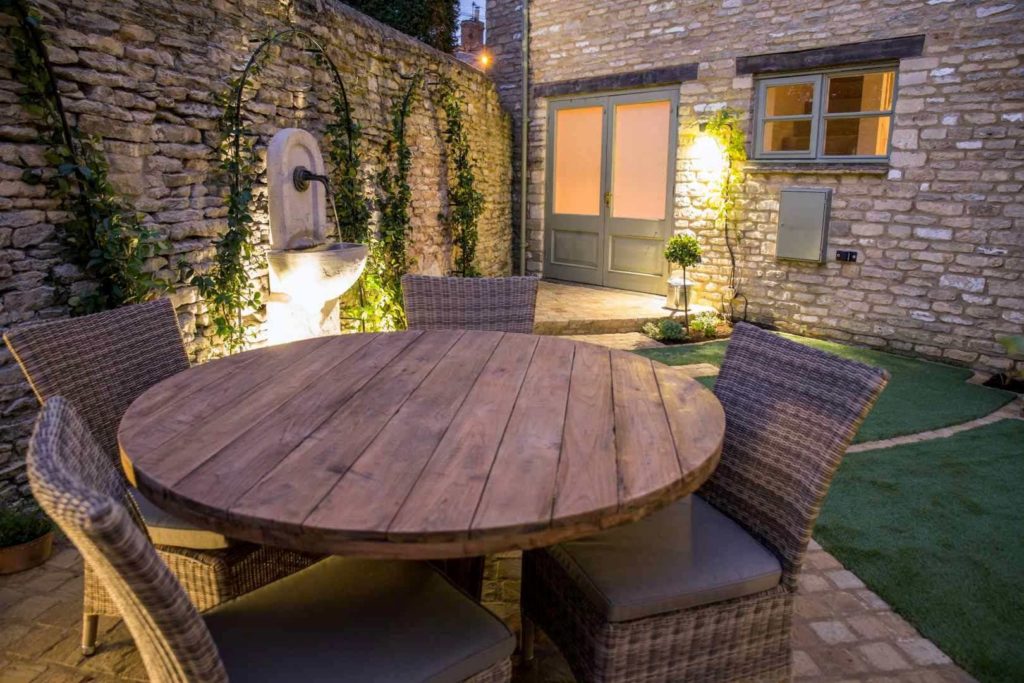 garden with water feature and seating area
